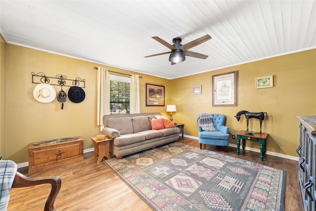 dining space with ornamental molding, sink, hardwood / wood-style flooring, and ceiling fan