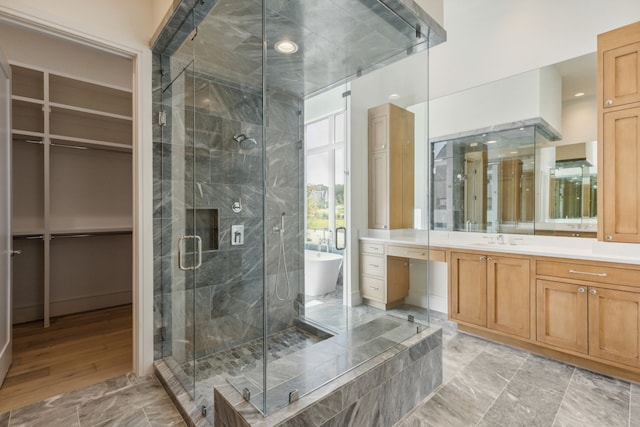 bathroom with vanity and plus walk in shower