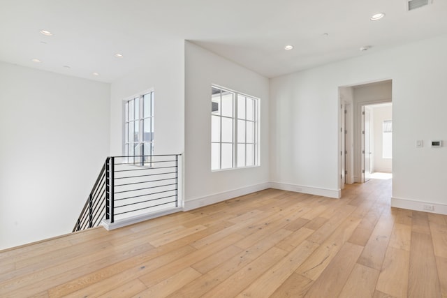 spare room with light hardwood / wood-style flooring