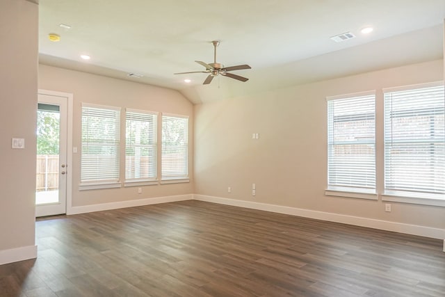 unfurnished room featuring dark wood-type flooring, ceiling fan, and vaulted ceiling