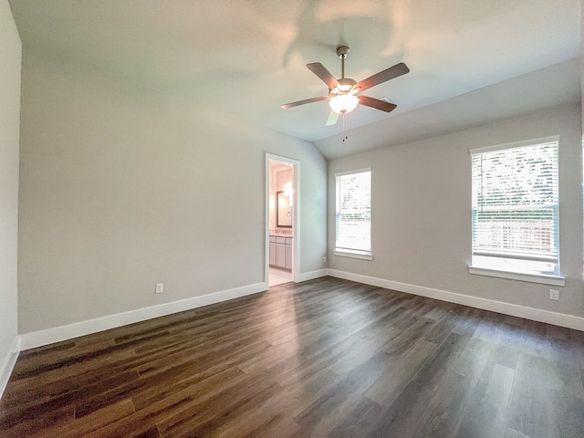 spare room with dark wood-type flooring and ceiling fan