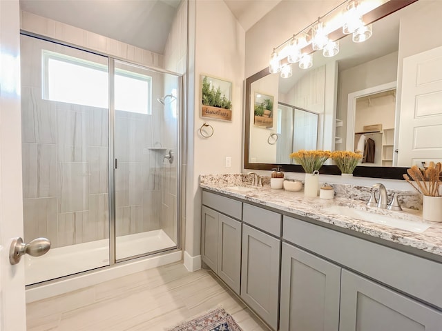 bathroom with vanity and walk in shower