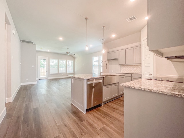 kitchen featuring gray cabinets, pendant lighting, dishwasher, a kitchen island with sink, and black electric cooktop