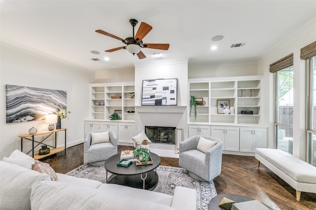 living room with ceiling fan, dark hardwood / wood-style floors, and ornamental molding