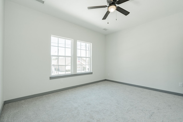 carpeted empty room with ceiling fan