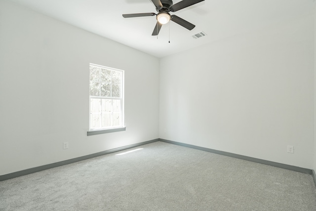 carpeted empty room with ceiling fan