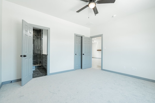 carpeted bedroom featuring ensuite bath and ceiling fan