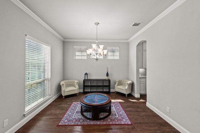 sitting room featuring a wealth of natural light, dark wood-type flooring, and crown molding