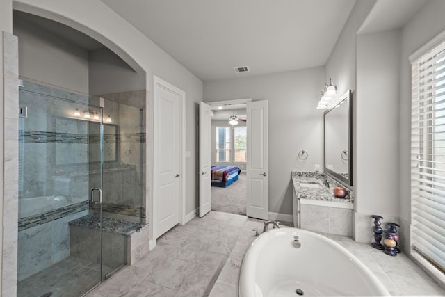 bathroom featuring ceiling fan, shower with separate bathtub, vanity, and tile patterned floors