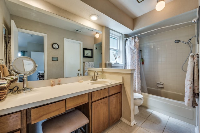 full bathroom with shower / tub combo with curtain, vanity, toilet, and tile patterned flooring