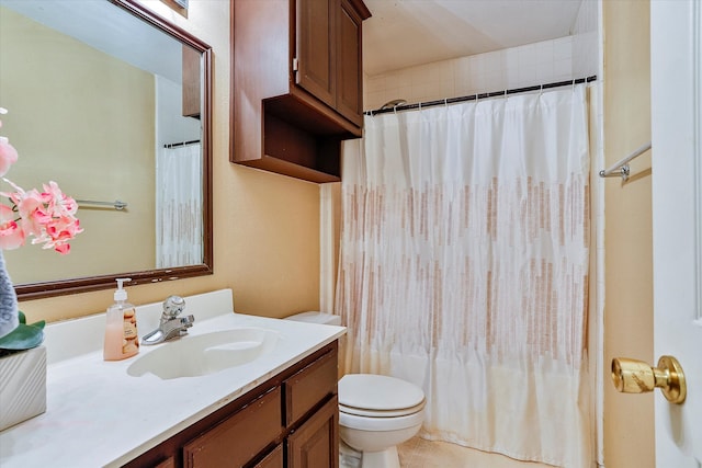 bathroom featuring toilet and vanity