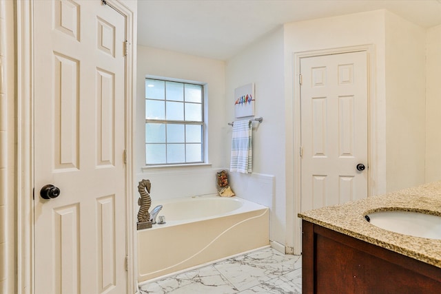 bathroom with tile patterned flooring, vanity, and a tub to relax in