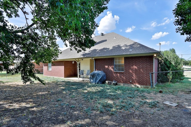 rear view of property featuring a patio area