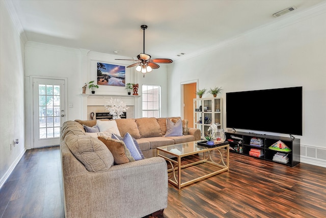 living room with ceiling fan, crown molding, and wood-type flooring