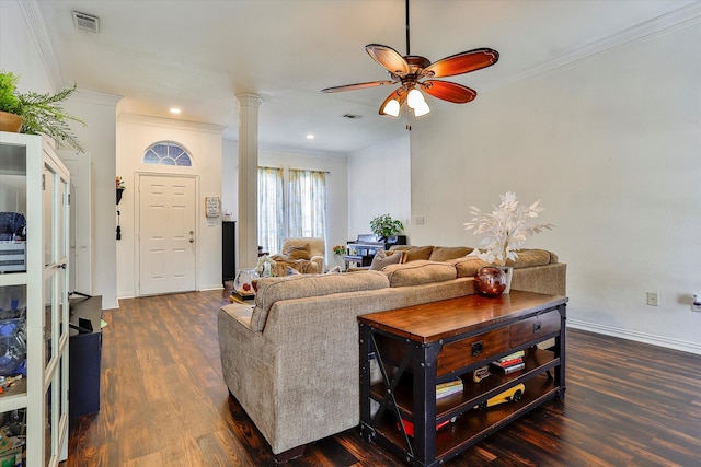 living room featuring ceiling fan, ornamental molding, dark hardwood / wood-style flooring, and ornate columns