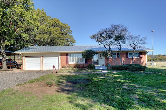 ranch-style home with a carport, a garage, and a front yard