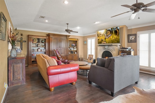 living room featuring ceiling fan, dark wood-type flooring, and ornamental molding