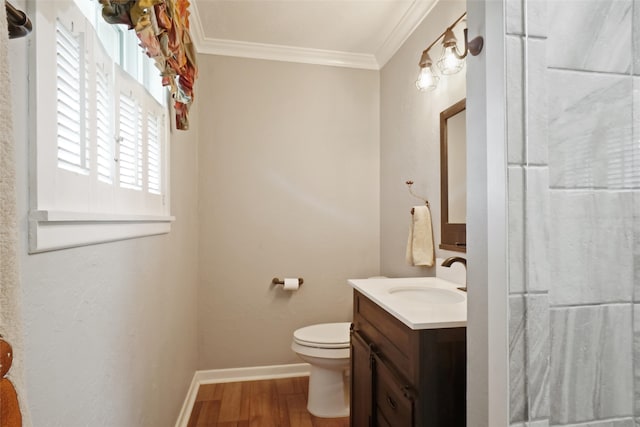 bathroom featuring wood-type flooring, toilet, vanity, and ornamental molding