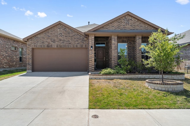 view of front facade with a garage and a front lawn