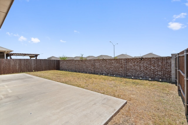 view of yard featuring a patio and a pergola