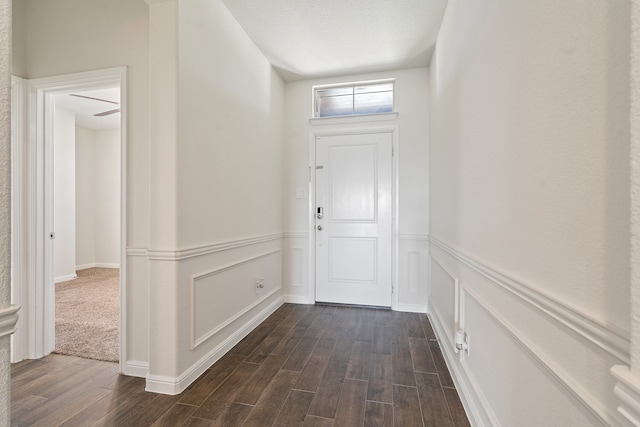 foyer with dark hardwood / wood-style floors