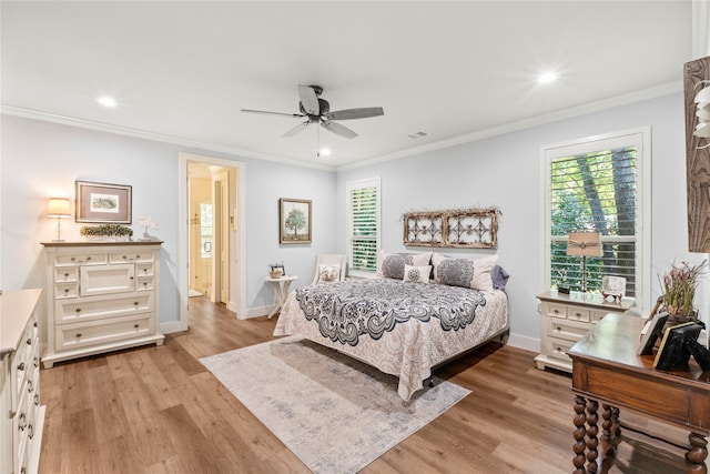 bedroom featuring light hardwood / wood-style floors, ornamental molding, and ceiling fan