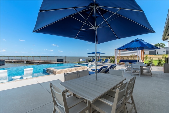 view of patio / terrace featuring a pool with hot tub