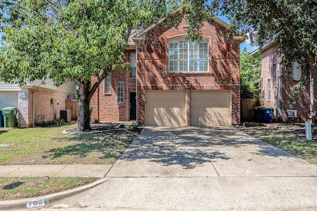 view of front property featuring cooling unit, a garage, and a front lawn