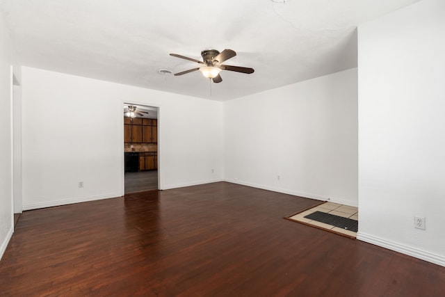 empty room featuring hardwood / wood-style floors and ceiling fan