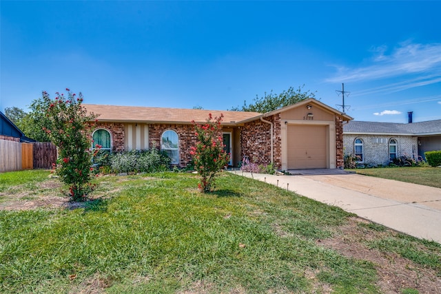 ranch-style house with a garage and a front lawn