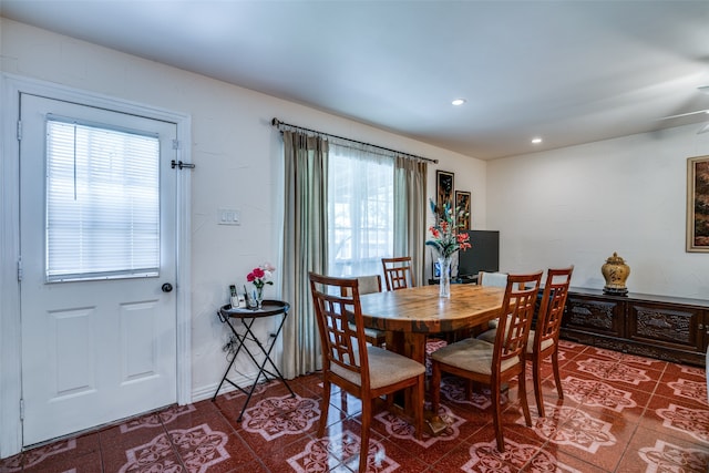 tiled dining space featuring a wealth of natural light