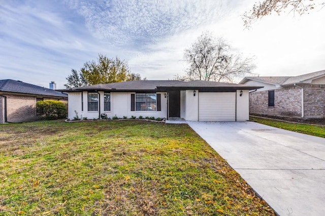 single story home with a front yard and a garage