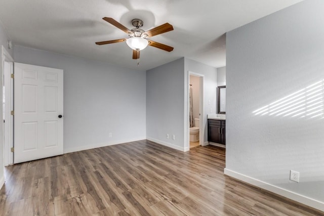 unfurnished living room with ceiling fan and light wood-type flooring