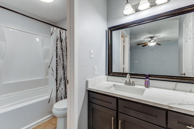 full bathroom with shower / bath combination with curtain, tile patterned floors, vanity, ceiling fan, and toilet