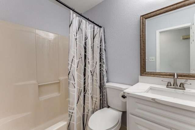 full bathroom with vanity, toilet, and shower / bath combo