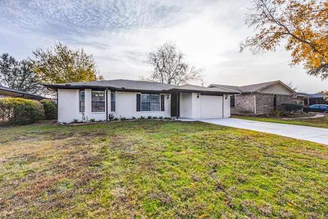 ranch-style home with a garage and a front lawn