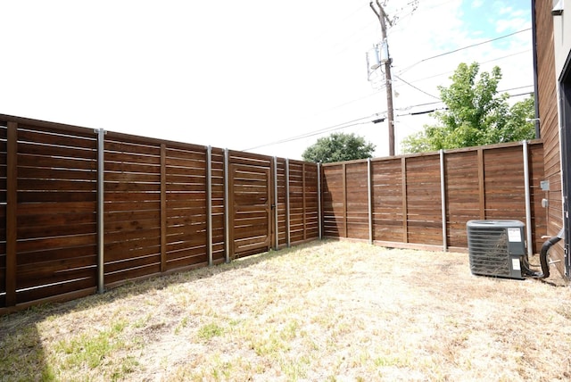 view of yard featuring central air condition unit