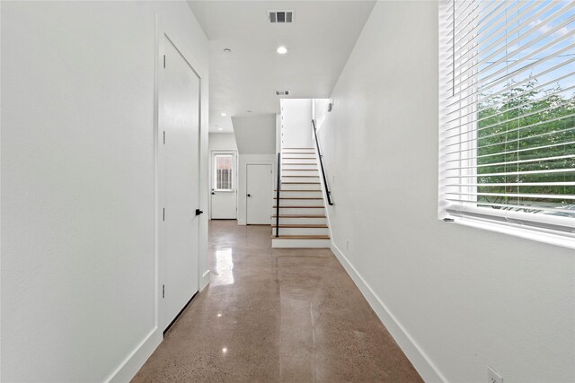2120 Lovedale Ave Unit 101, Dallas, TX 75235 - corridor with finished concrete flooring, stairway, baseboards, and recessed lighting