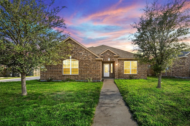 view of front of property with a yard