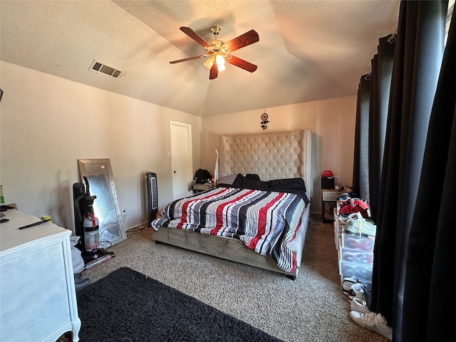 carpeted bedroom featuring ceiling fan, a textured ceiling, and lofted ceiling