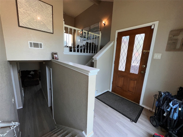 foyer entrance with hardwood / wood-style floors