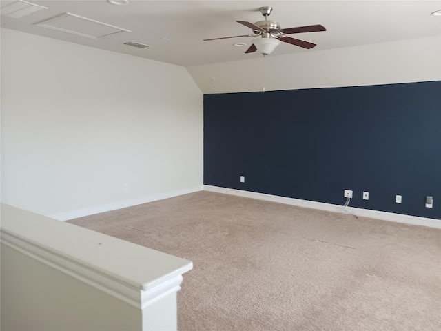 unfurnished room featuring lofted ceiling, light colored carpet, visible vents, recessed lighting, and a ceiling fan