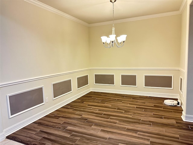 unfurnished dining area featuring crown molding, dark wood-style flooring, a chandelier, and baseboards