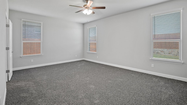 empty room with ceiling fan and carpet flooring