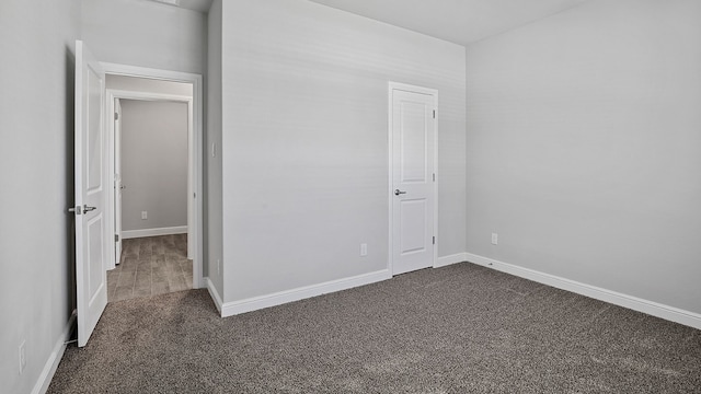 unfurnished bedroom with carpet floors