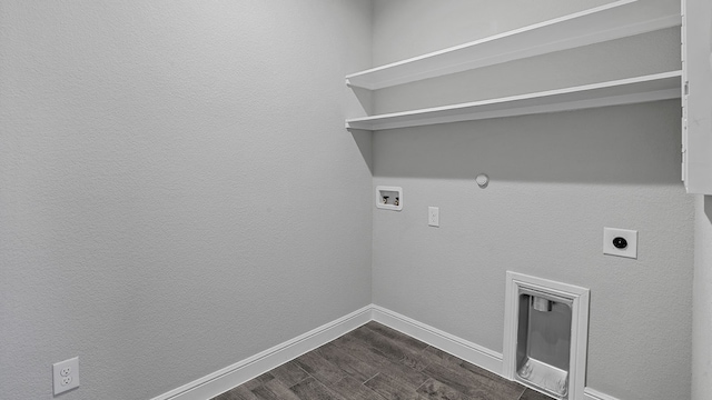 clothes washing area featuring hookup for a washing machine, electric dryer hookup, dark hardwood / wood-style flooring, and gas dryer hookup