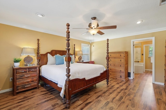 bedroom with crown molding, multiple windows, and wood-type flooring