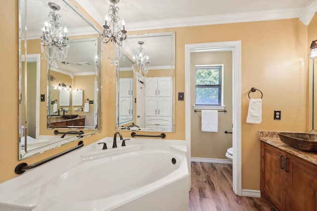 bathroom with toilet, vanity, wood-type flooring, an inviting chandelier, and crown molding