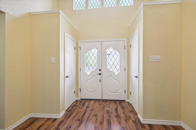 entryway featuring crown molding and wood-type flooring