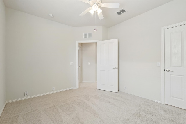 unfurnished bedroom with ceiling fan and light colored carpet